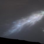 a rainbow colored “feather” in the martian sky