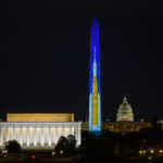 best of 2025: artemis ii sls (space launch system) projected on washington monument