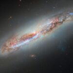 hubble glimpses galactic gas making a getaway