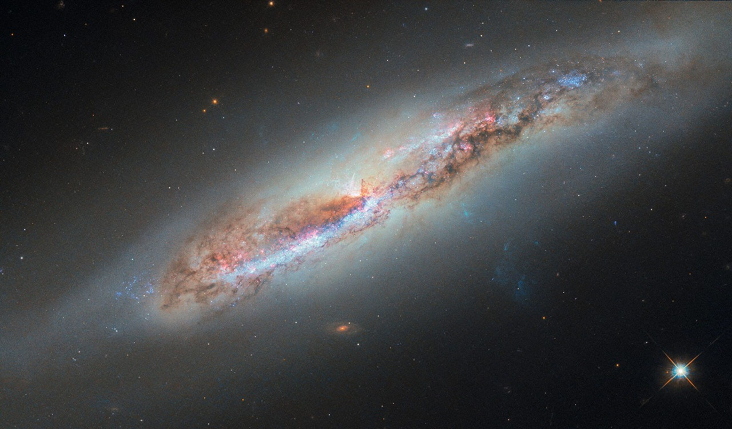 hubble glimpses galactic gas making a getaway