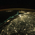 fishing boats and city lights